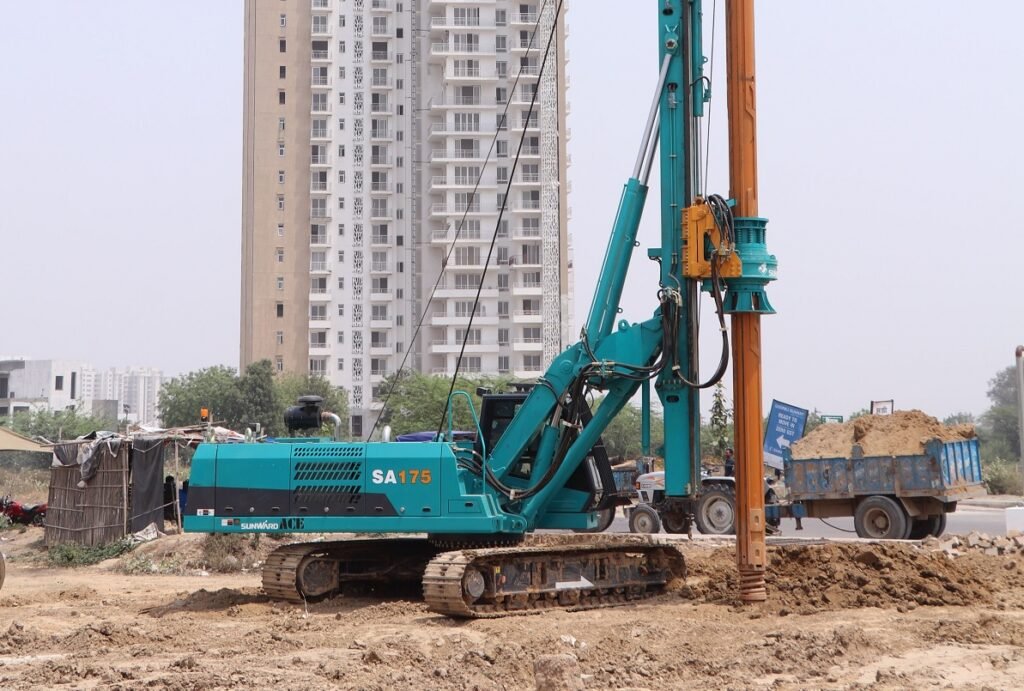 A drilling rig taking a borehole sample on a cleared construction site