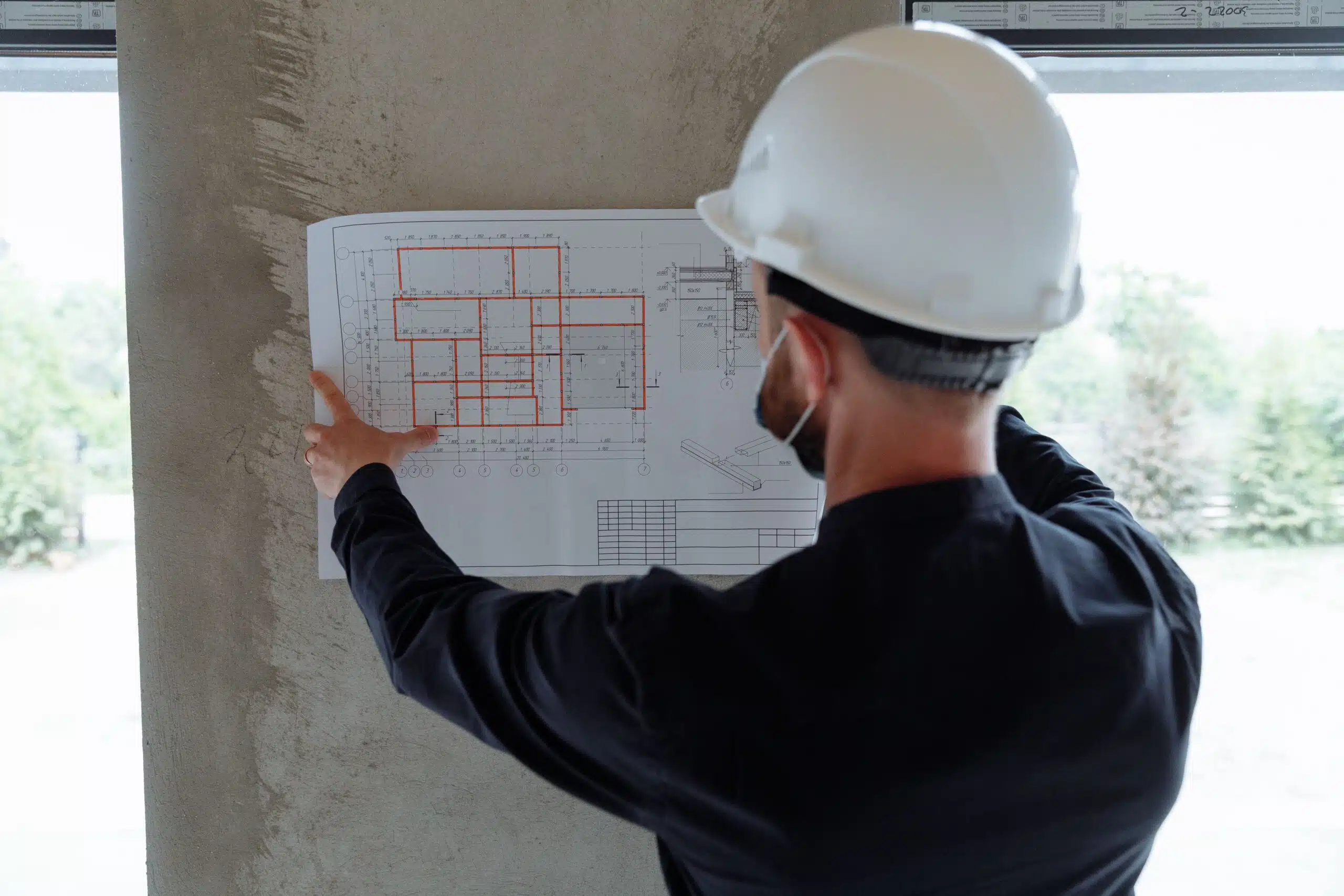 Engineer carrying out a building inspection on a concrete structure