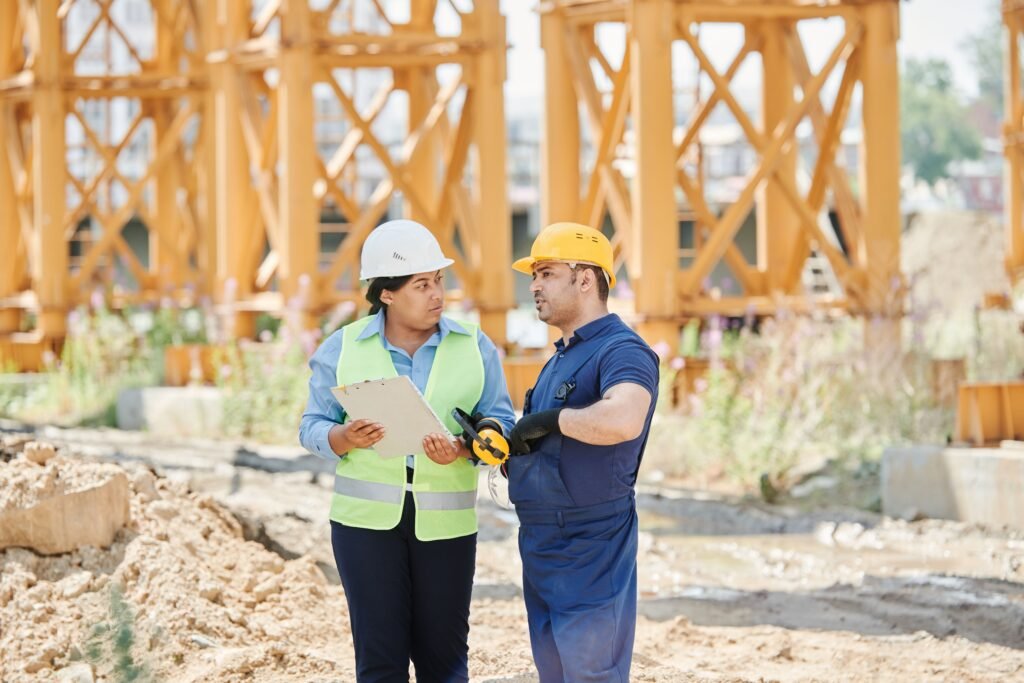 Land surveyor using a total station on a construction site in the Gulf